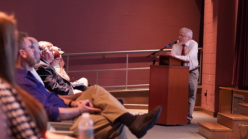 Dr. Gidcomb lecturing in Ledbetter Auditorium,