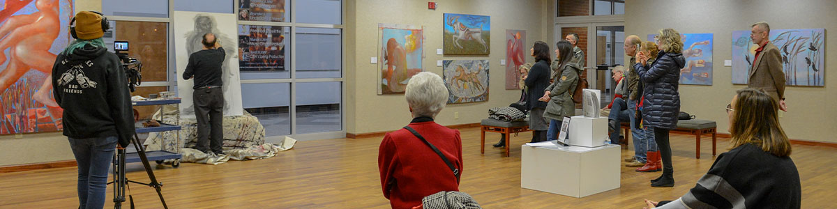 people viewing exhibit