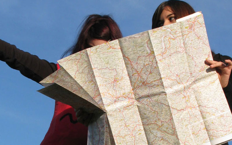 two people looking at a map