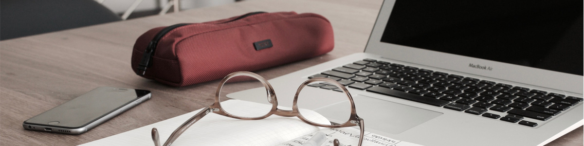 laptop, notepad, phone, glasses