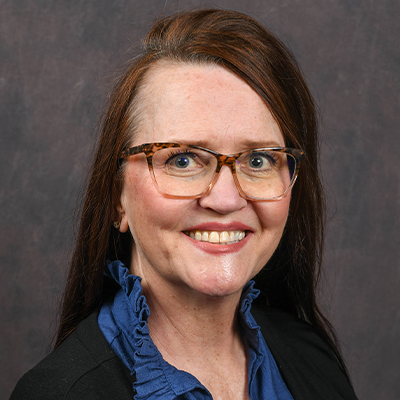 Profile photo of Cindy Clark, testing assistant, in front of a professional backdrop.
