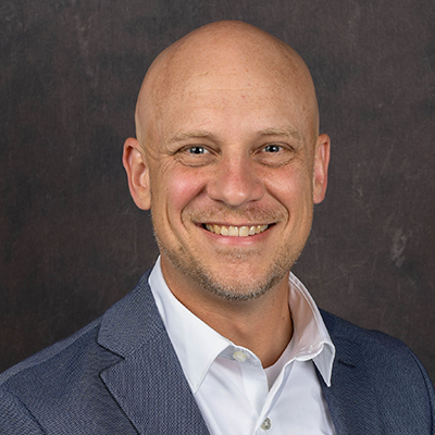 Profile photo of Ryan Fowler, a Director, in front of a professional backdrop.