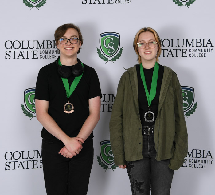 Visual Art Winners (left to right): Third place winner, Bradley Hege of Summit High School and second place winner, Anna Schraber of Summit High School. Not pictured: First place winner student from Richland High School.