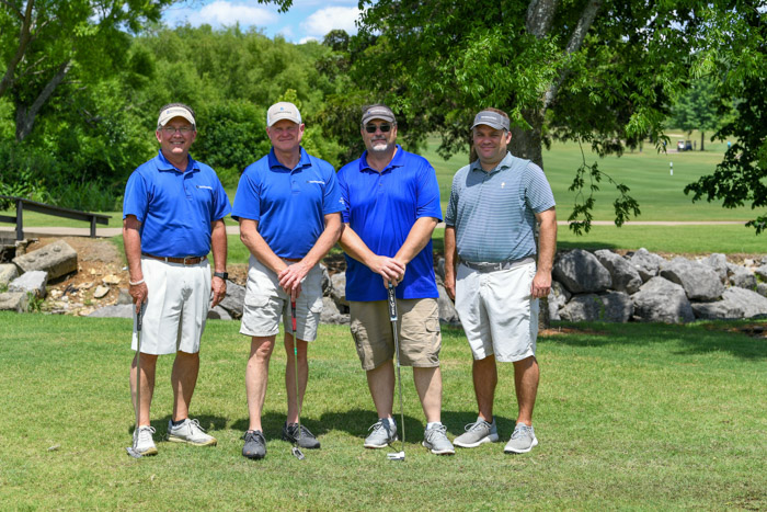 Pictured (left to right): First Flight, first place winners Don Haney, Mark Hayes, Lyman Cox and Chad Haney.