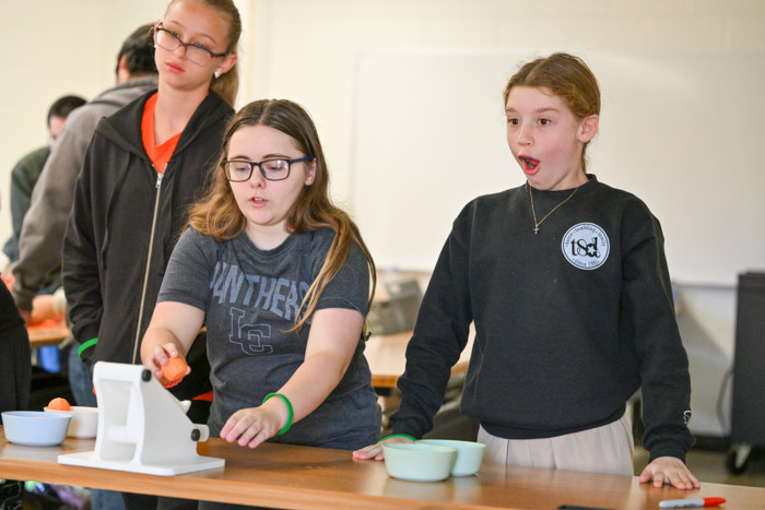 Two STEM Within Reach students participate in the 3-D printed pumpkin launching activity.