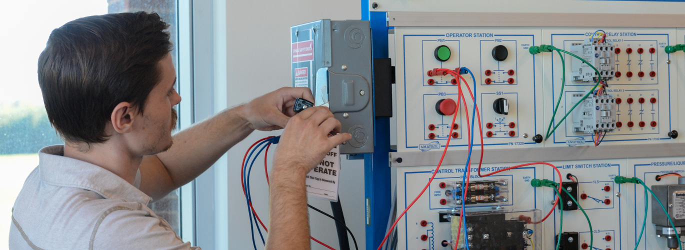 Nicholas Wilkes, Columbia State instructor of Engineering Systems Technology, seen operating a Motor Control System workstation at the Lawrence Campus.