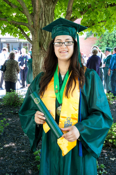 Girl in glasses wearing cap and gown