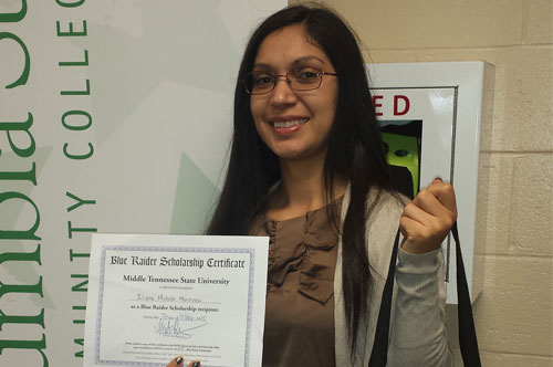 Iliana with scholarship certificate