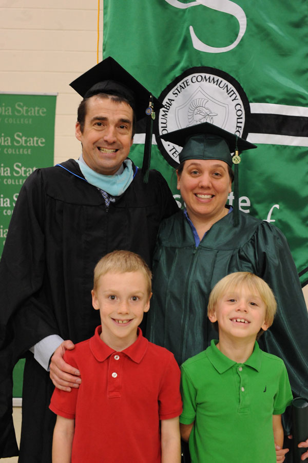 Female graduate with husband and kids