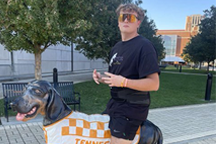 Student with dog, Smokey, statue