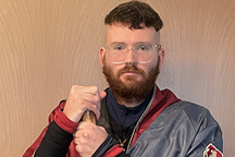 Student in robe with staff